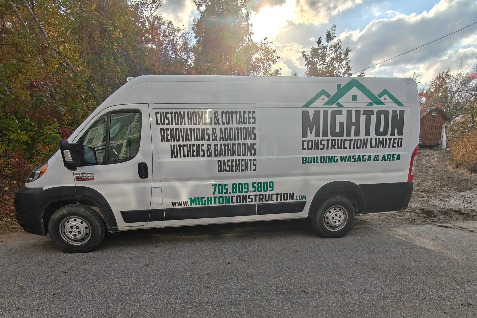 Mighton Construction Limited work van lettered Building Wasaga & Area, listing custom homes and cottages, renovations and additions, kitchens and bathrooms, and basements