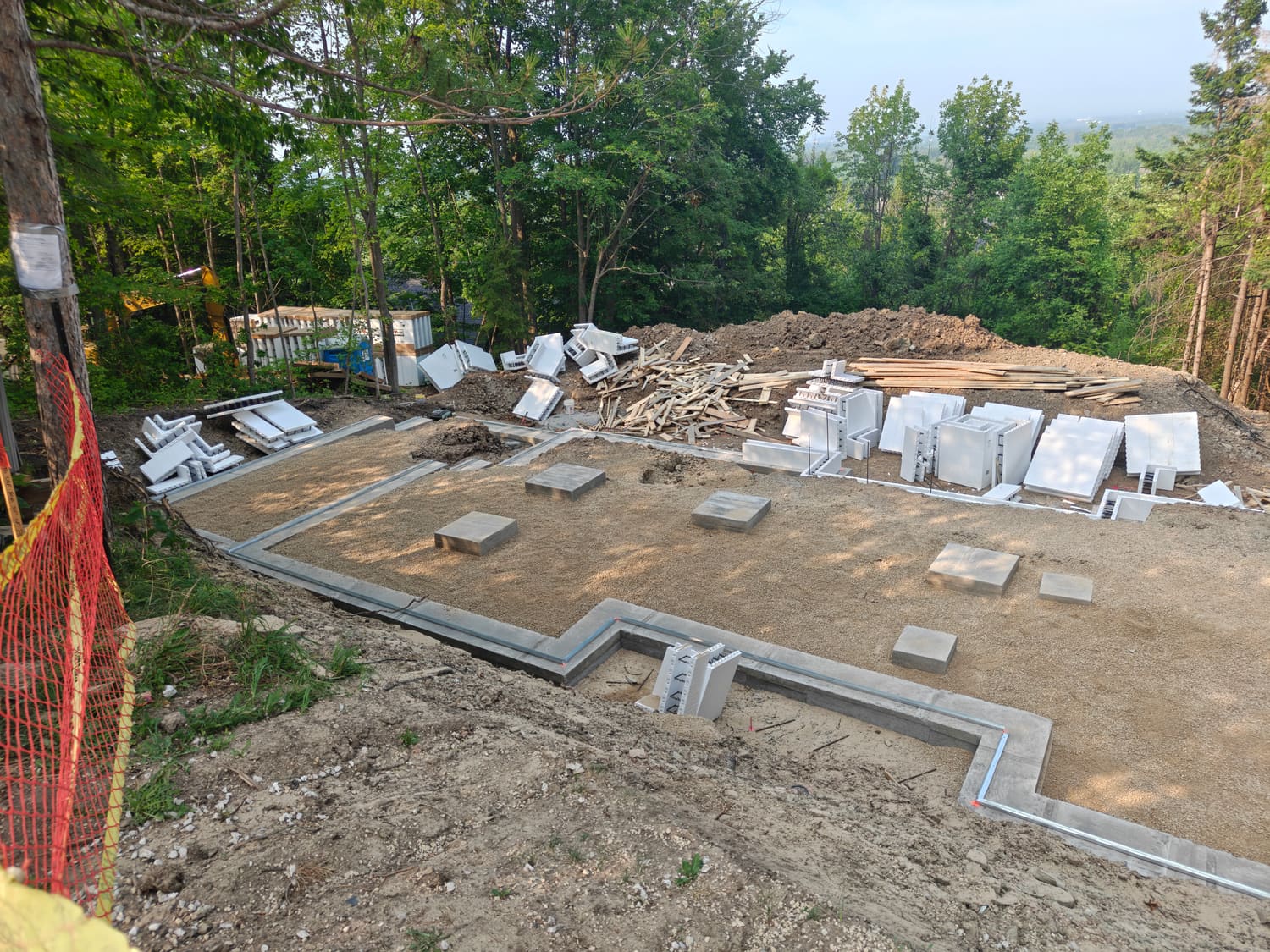 Fox Blocks ICF blocks staged beside the finished footings at 105 Orchard Lane, Clearview