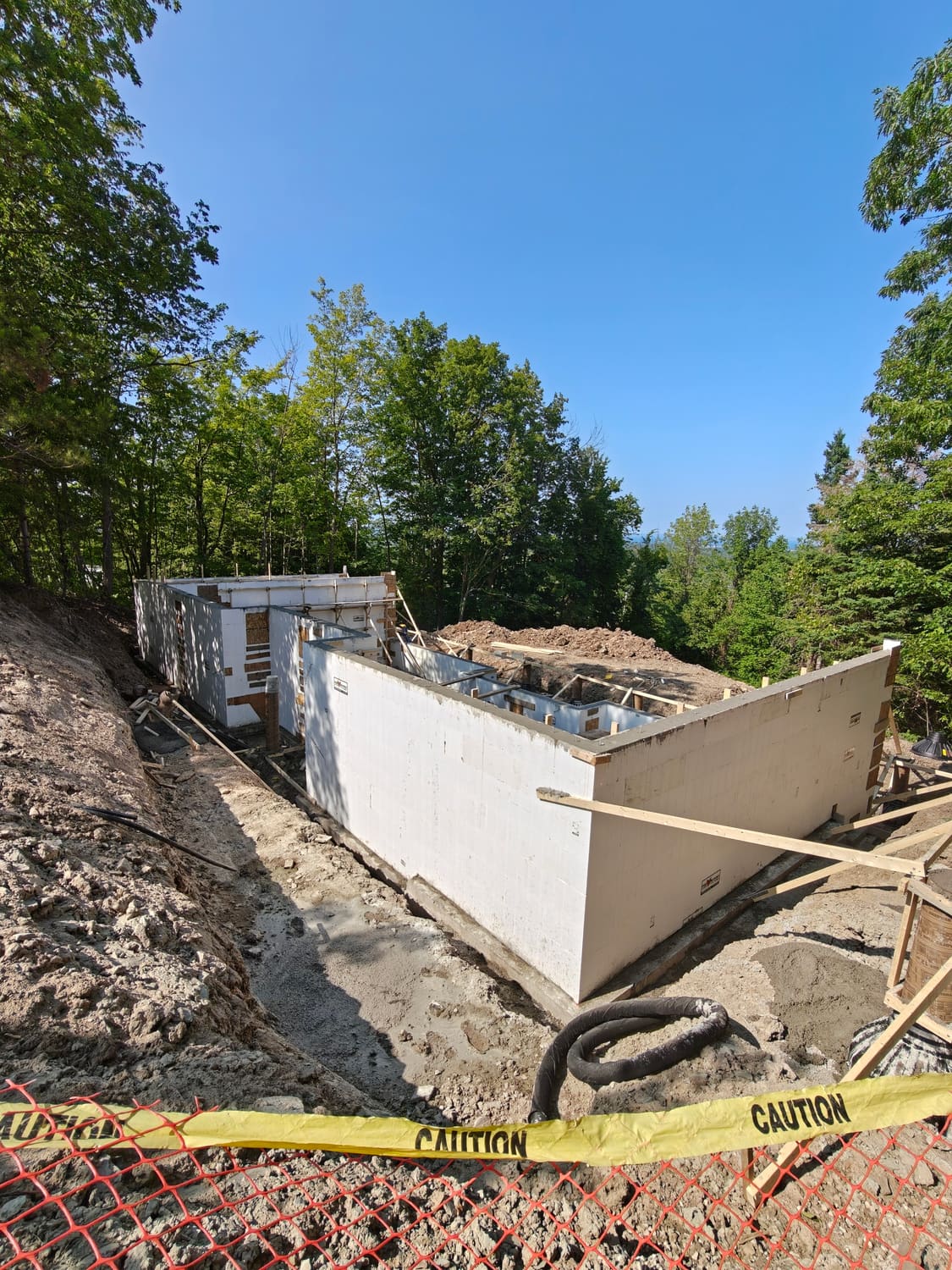 ICF foundation wall corner and footing drainage trench at 105 Orchard Lane, Clearview