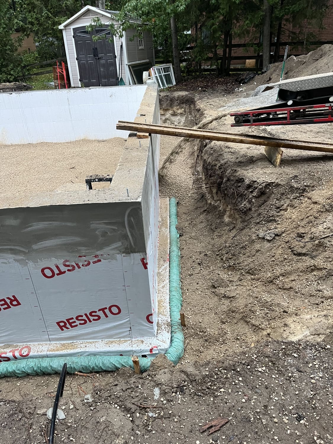 Foundation wall corner showing exterior membrane and drainage detail at 21 1st Lane in Wasaga Beach