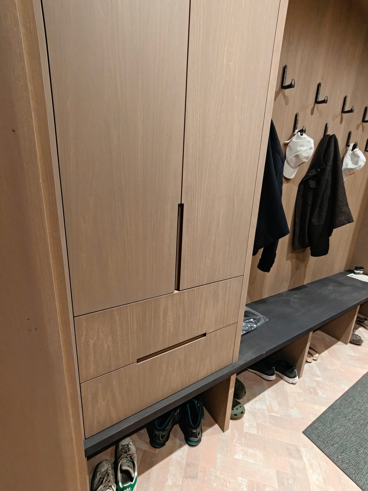 Custom mudroom cabinet with drawers and recessed pulls above a bench at 23 Forest Drive, Collingwood