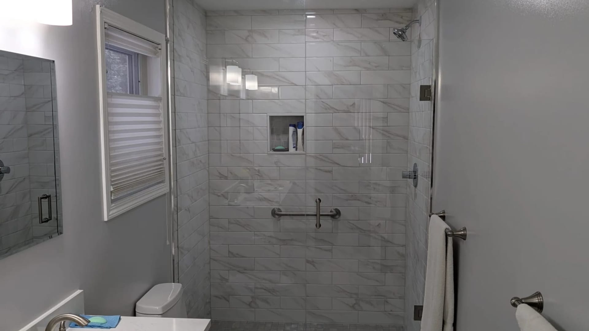 Custom-tiled walk-in shower in the 23 Indiana Ave bathroom renovation in Wasaga Beach