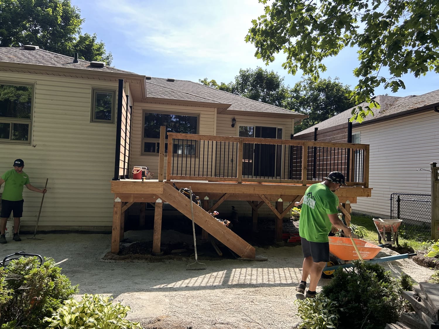 New aluminum railings and prepared patio base beneath the deck at 46 Timberland Cres, Wasaga Beach