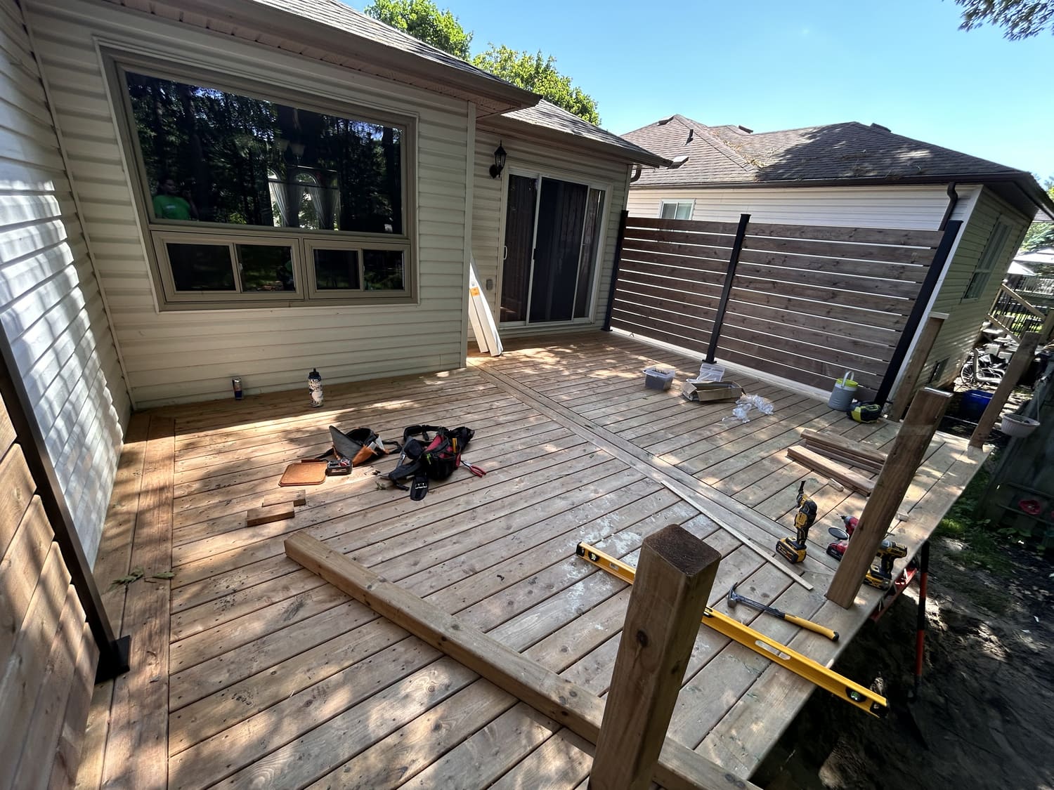 New pressure-treated deck boards and a privacy wall at 46 Timberland Cres in Wasaga Beach