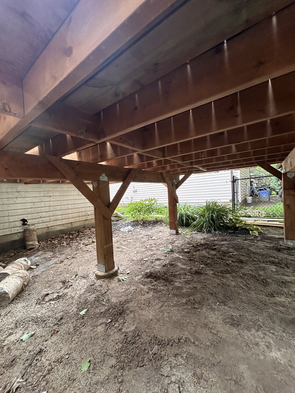 Underside of the new deck showing 6x6 posts, beams and joists at 46 Timberland Cres, Wasaga Beach