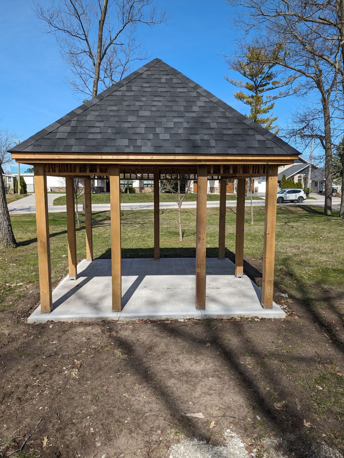 Finished hip-roof timber gazebo on a new concrete pad at Wasaga Beach Town Hall, built by Mighton Construction
