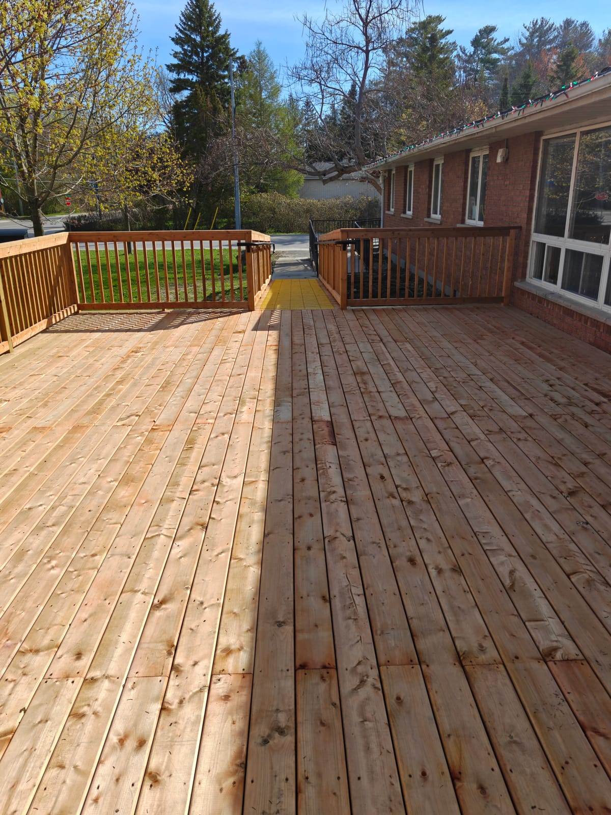 Accessible ramp and new pressure-treated deck at the Town of Wasaga Beach Youth Centre, built by Mighton Construction